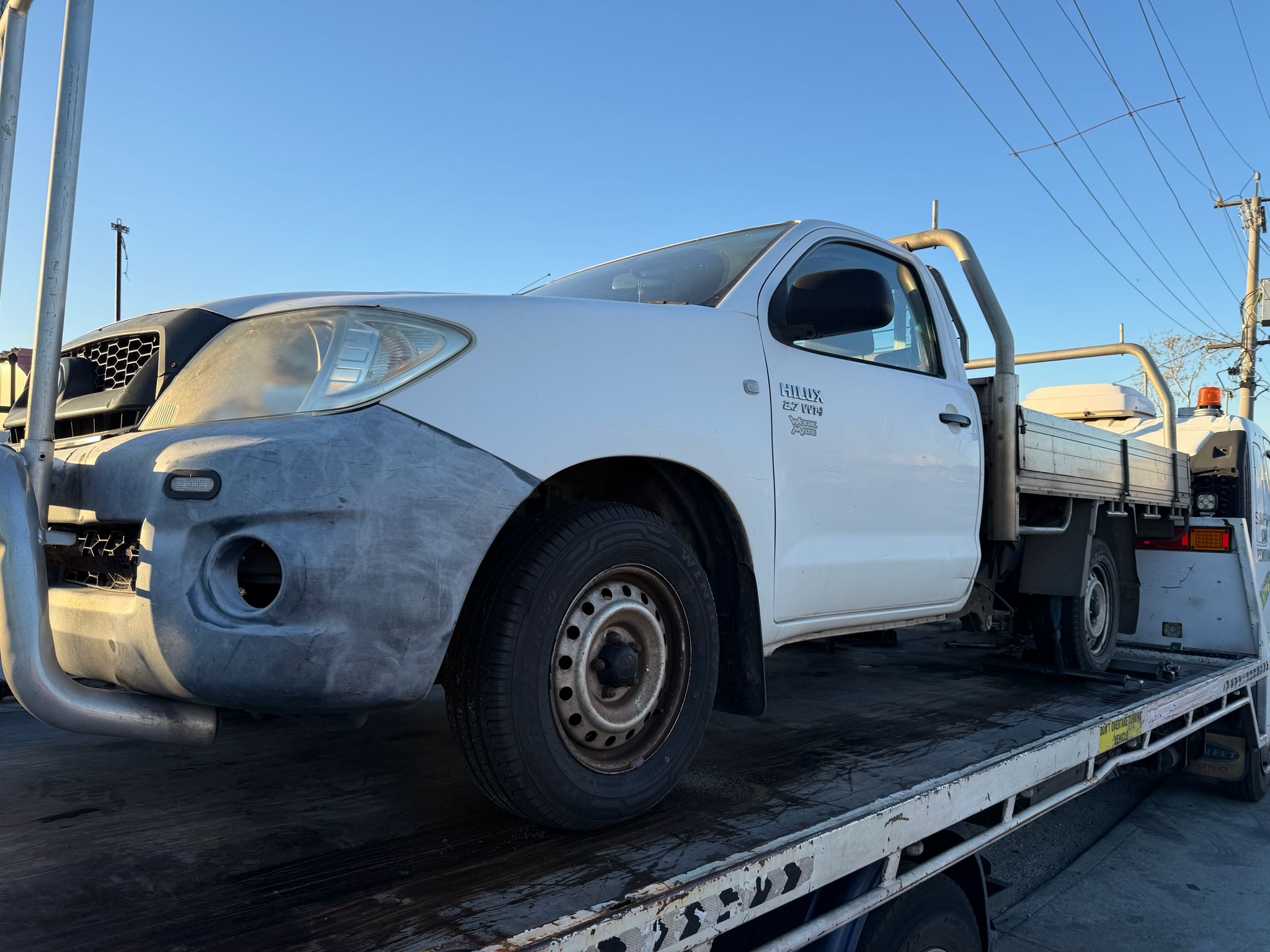 Tow truck removing scrap car in Perth